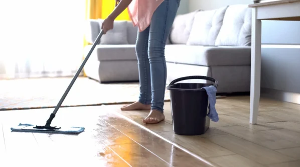 Woman-cleaning-linoleum-flooring