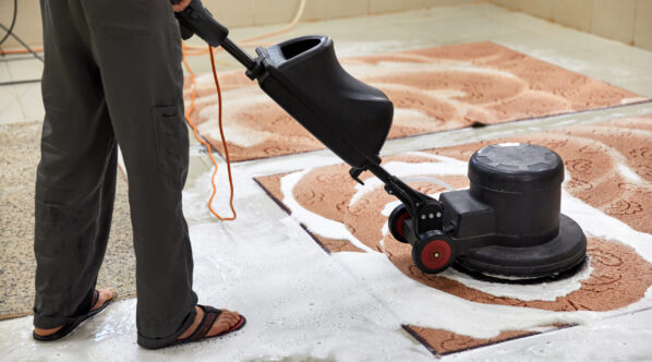 Carpet chemical cleaning with professionally disk machine. Early spring cleaning or regular clean up. High quality photo