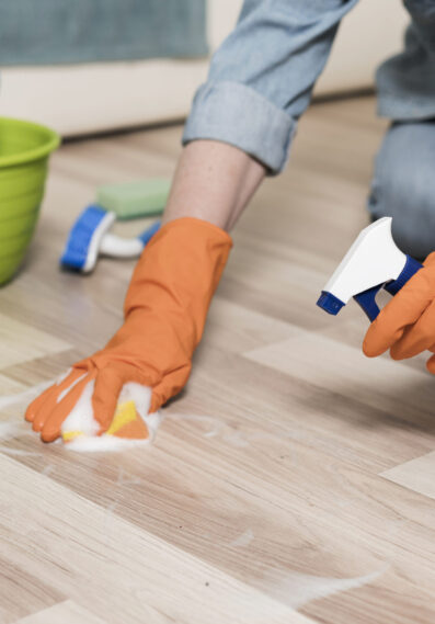 woman-with-rubber-gloves-cleaning-floors (1)
