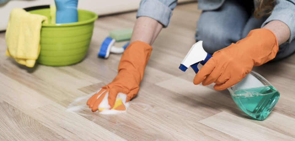 woman-with-rubber-gloves-cleaning-floors (1)